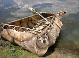 Tibet Lhasa 01 04 Coracle Just Outside Lhasa Next to the Buddha rock carving just 11km from Lhasa, an enterprising young man has a coracle to take you for a short ride. A coracle is a surprisingly strong and light boat made with yak hide stretched over a wooden frame.